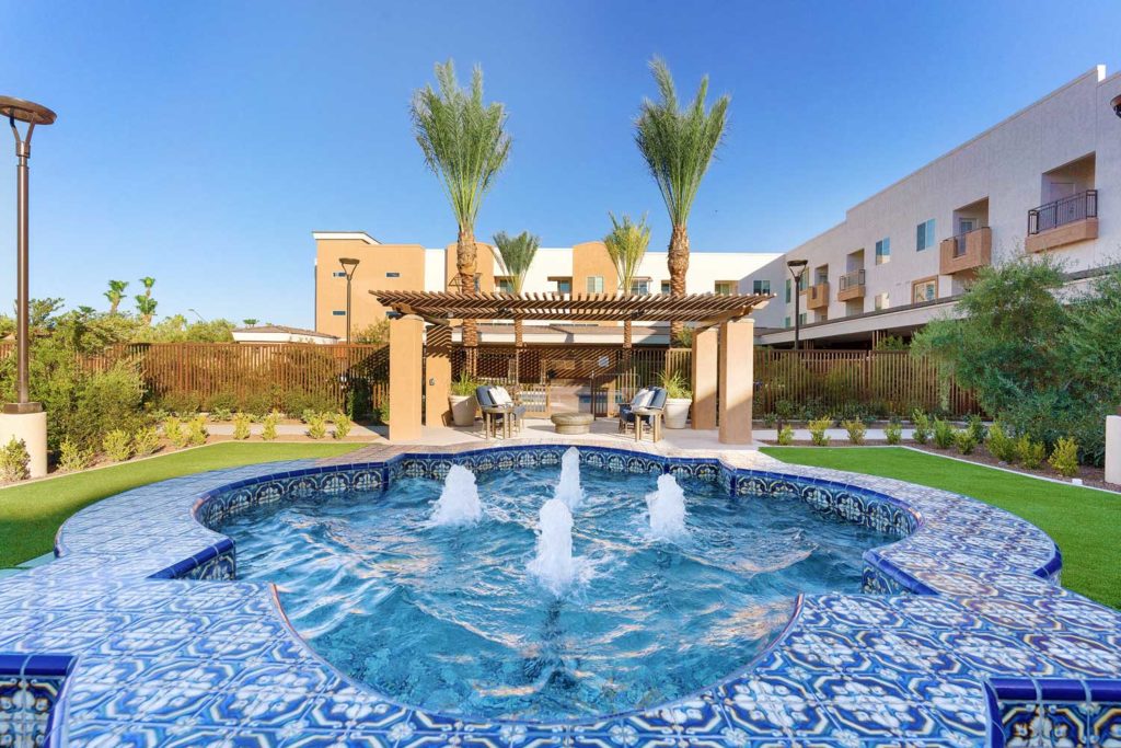Blue tile fountain in courtyard at luxury retirement community in Goodyear, Arizona