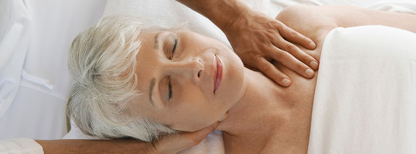 a female senior participates in massage therapy