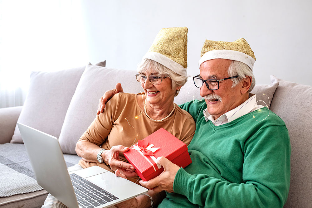 Seniors celebrating holidays virtually. Discover ways to celebrate the holidays when you live away from family