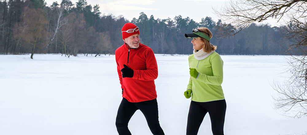 Seniors exercising outdoors in the winter. Learn fun ways to stay active during the winter in Arizona.